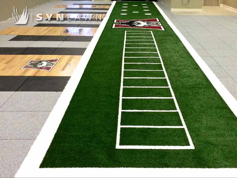 SYNLawn SpeedTurf Track at university indoor facility with logo embedded in the turf