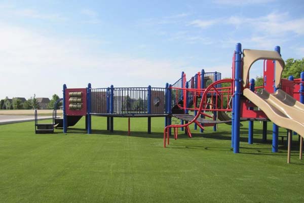 Large playground turf installation at colorful playground in Southern Illinois