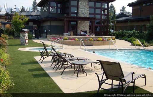 Artificial grass surrounds pool deck area for commercial resort in Kansas