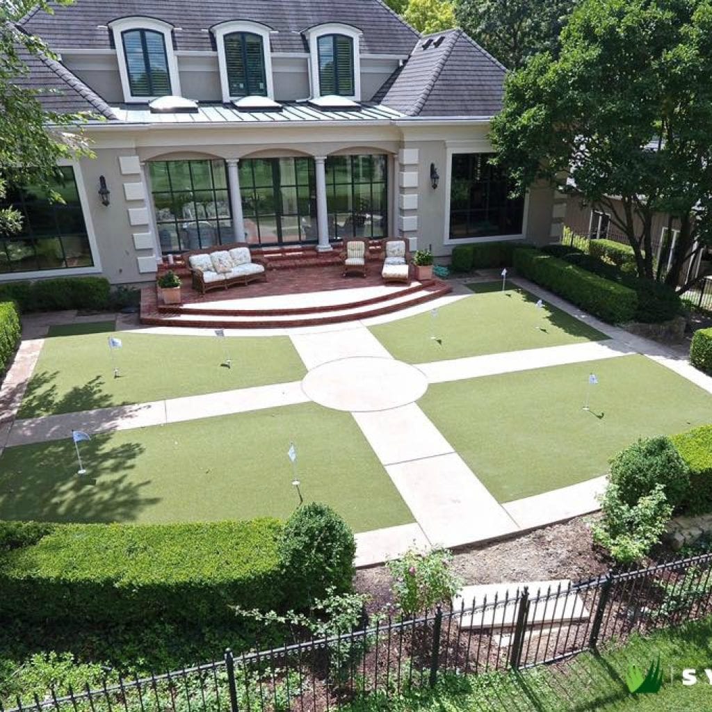 Artificial turf backyard with putting green