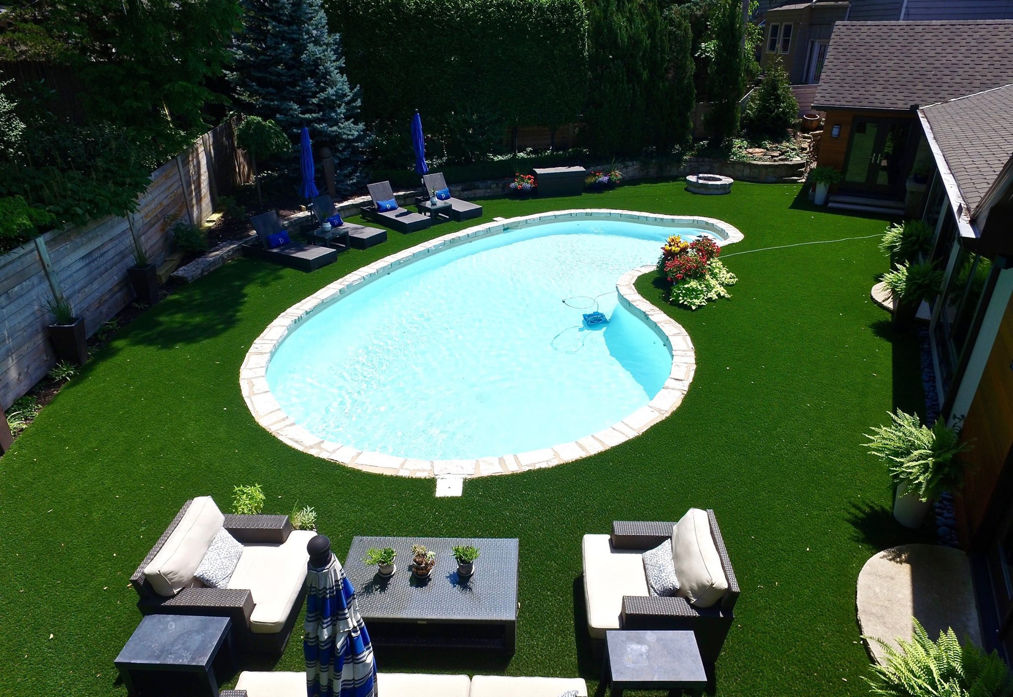 Kansas City backyard with artificial turf and a pool