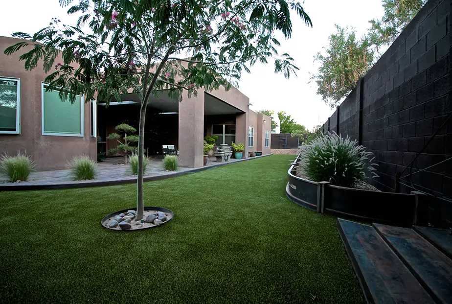 Backyard artificial grass installation