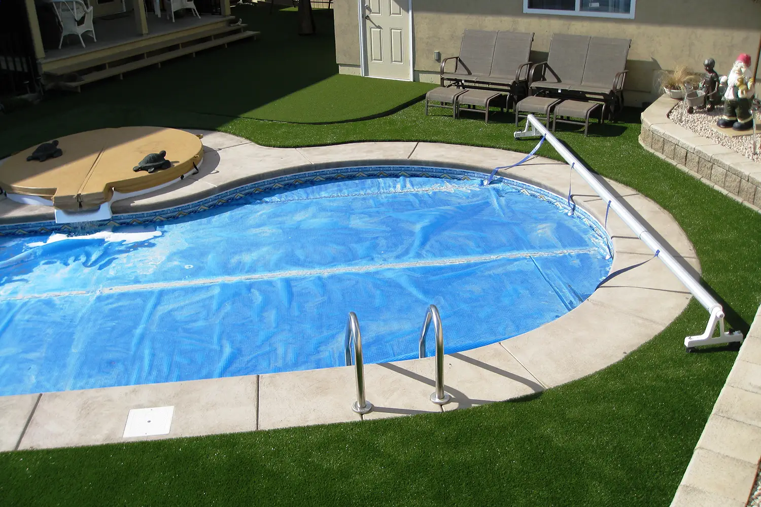 backyard pool area turf installed by SYNLawn Kansas City